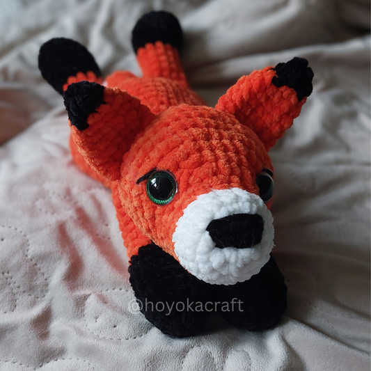Fox lying down crochet plushie