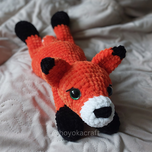 Fox lying down crochet plushie
